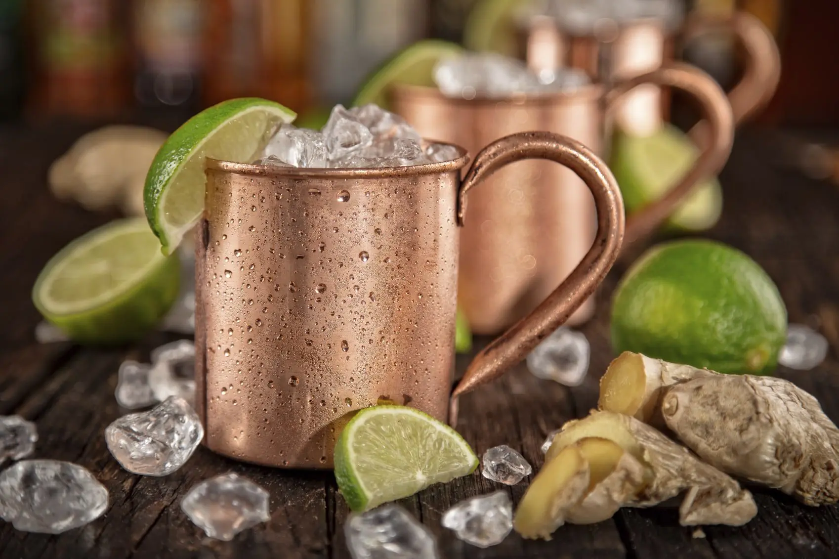 Friday Cocktail - Moscow Mule 4 Cold Moscow Mules - Ginger Beer, lime and Vodka on bar