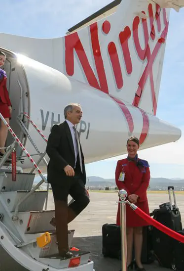 Virgin boss John Borghetti steps off a plane in Tamworth