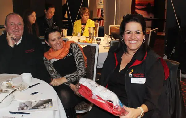 Gifts & smiles at the final Visit USA expo 11 Brand USA 2