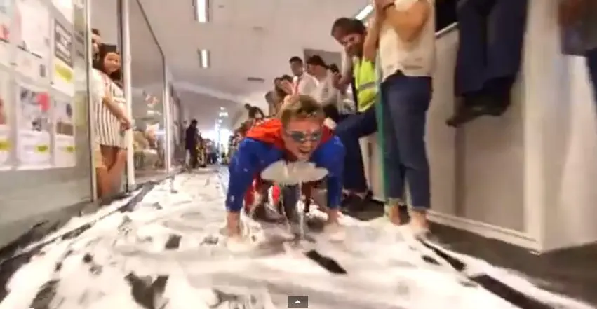 Superman, Deadpool & an ape join Flight Centre's epic slip n' slide