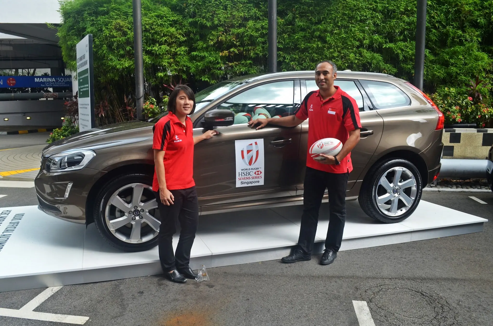 Singapore relishes home advantage for inaugural South East Asia Sevens 2 National captains Alvinia Ow and Daniel Marc Chow with Volvo XC60 car filled with rugby balls