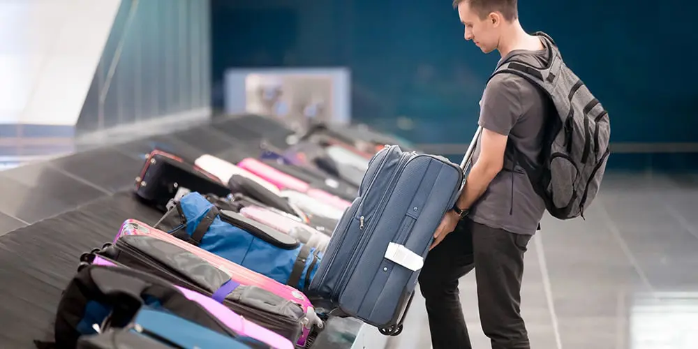 man-getting-his-luggage