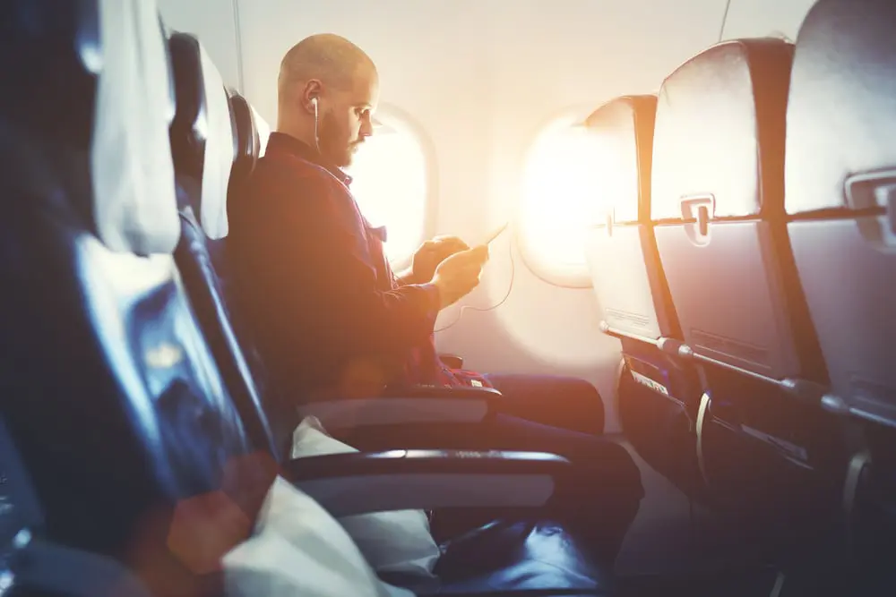 Smoking on planes to sustainable travel: 5 ways travel has changed in 40 years 19 mobile-phone-on-plane