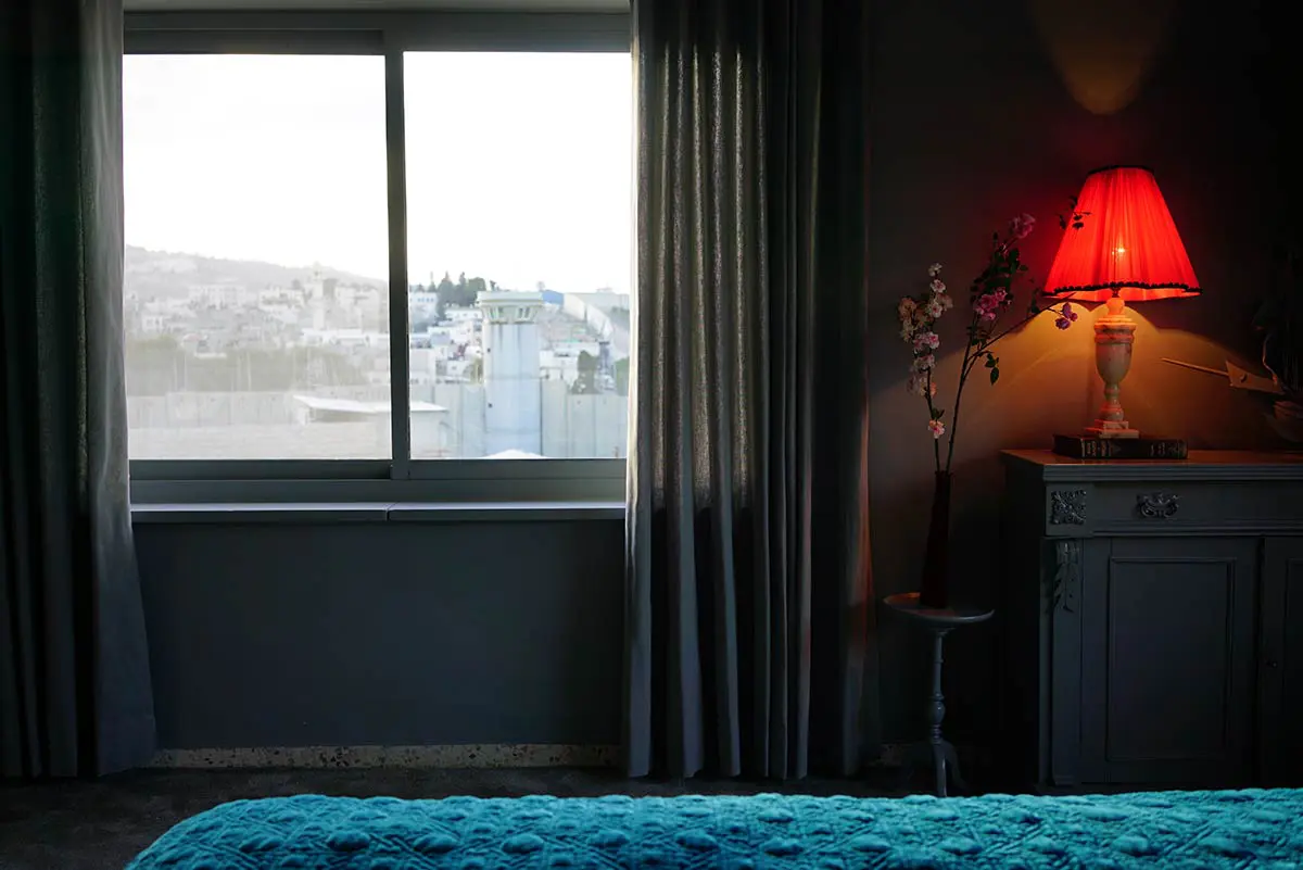 Banksy opened a hotel & it has the ‘worst view in the world’ 1 The Walled Off Hotel 3