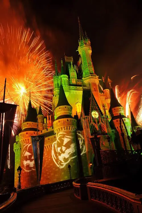 THE 2ND TRAVEL AGENT GOING ON THE DISNEY FAMIL IS... 5 Orange fireworks explode over Cinderella Castle while illuminated pumpkins are projected with light during the "Happy HalloWishes" fireworks show. The show is part of "Mickey's Not-So-Scary Halloween Party," an after-hours Halloween celebration at the theme park. A separate ticket is required to attend. (Gene Duncan, photographer)
