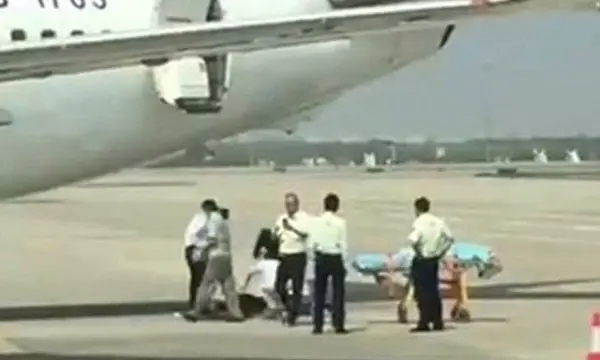 WATCH: Shocking moment when a flight attendant fell from a parked plane 1 Image: South China Morning Post