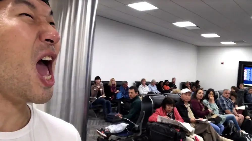 Some rando broke out in K-POP at an airport & it's freaking hilarious