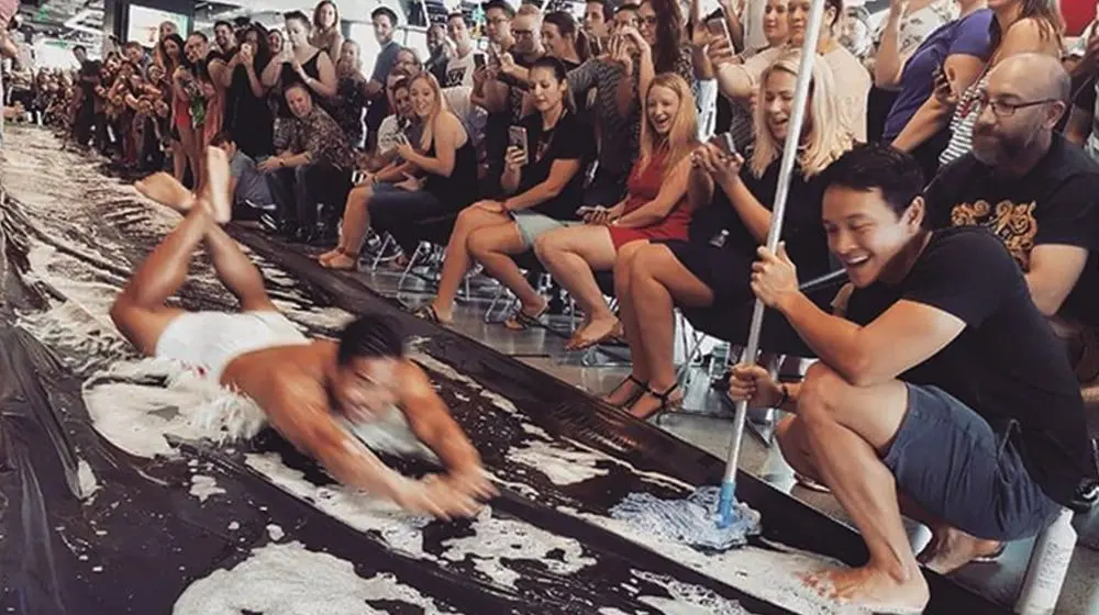 PICTURES: G-strings & fluro pink bathers at Flight Centre's annual slip 'n side