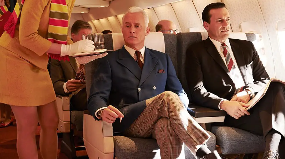 Smoking on planes to sustainable travel: 5 ways travel has changed in 40 years 17 Mad Men smoking on a plane