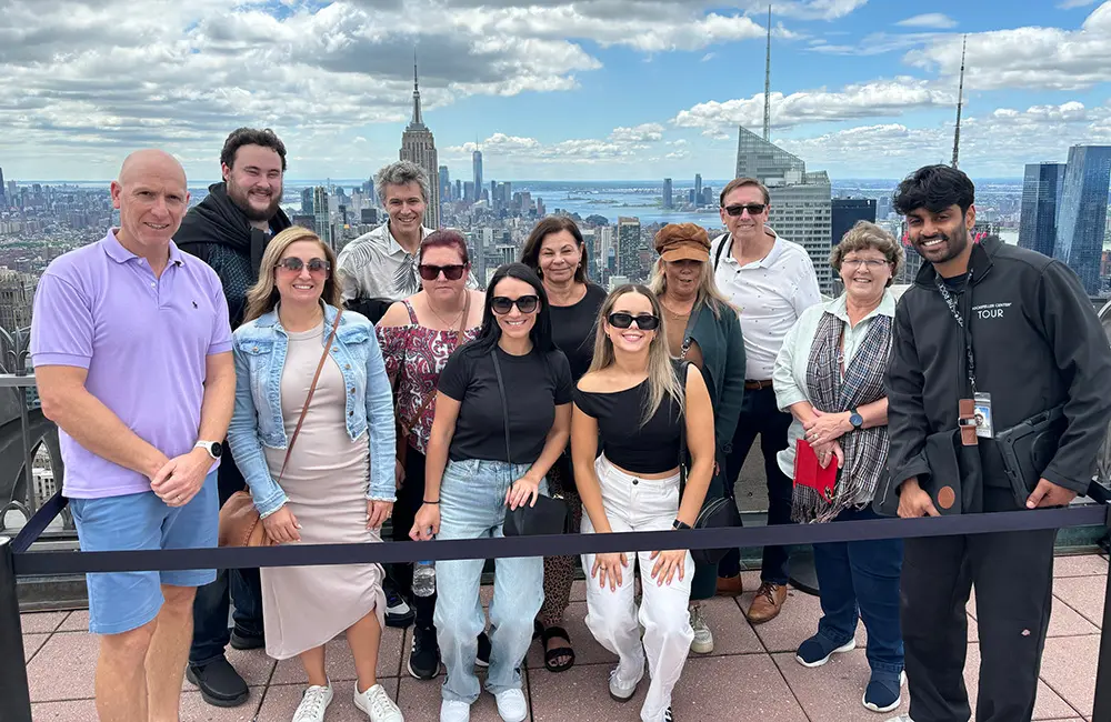 Hot dog! Helloworld agent snaps up NYC trip in Air New Zealand x Viva Holidays incentive 1 Viva Holidays NYC famil winners at the Top of the Rock in New York City.