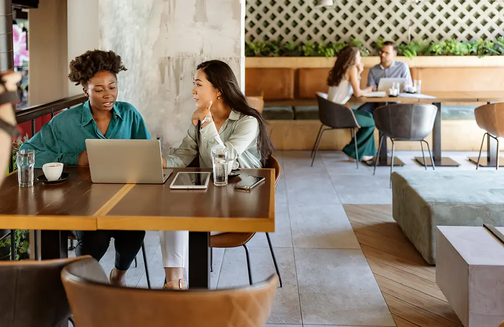 From perks to play: 1 in 2 APAC business travellers miss out on top global bleisure trends 4 Female work colleagues in hotel lobby for LGBTQIA+ travel concept APAC business travellers – trends