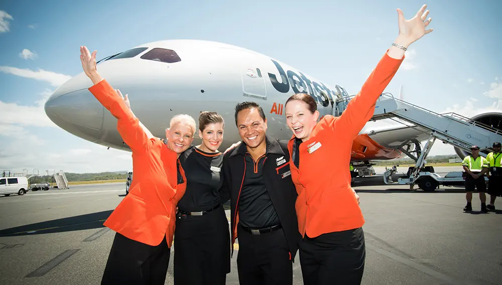 Jetstar crew on tarmac outside plane on Gold Coast.