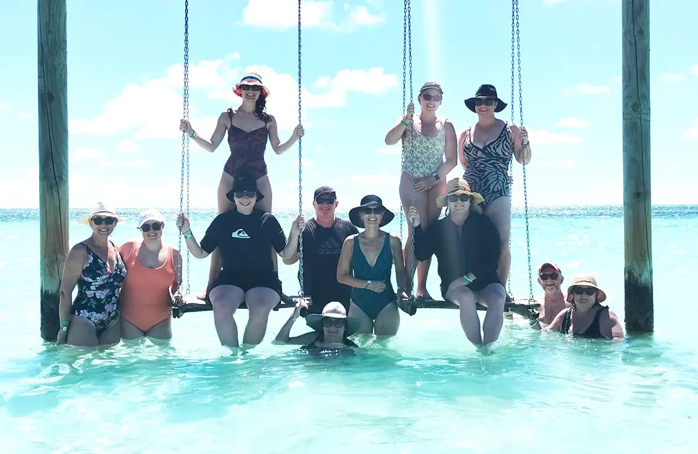Malaysia Airlines just made it easier for Aussies to travel to the Maldives 3 Group of Travellers Choice members on swing in ocean at Club Med Kani in the Maldives.
