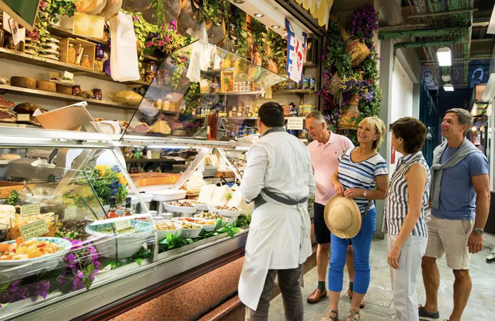 Tour de force: CATO report shows touring is steering Australia’s outbound travel boom 3 Tour group in a deli in Italy on a Back-Roads Touring small-group journey.