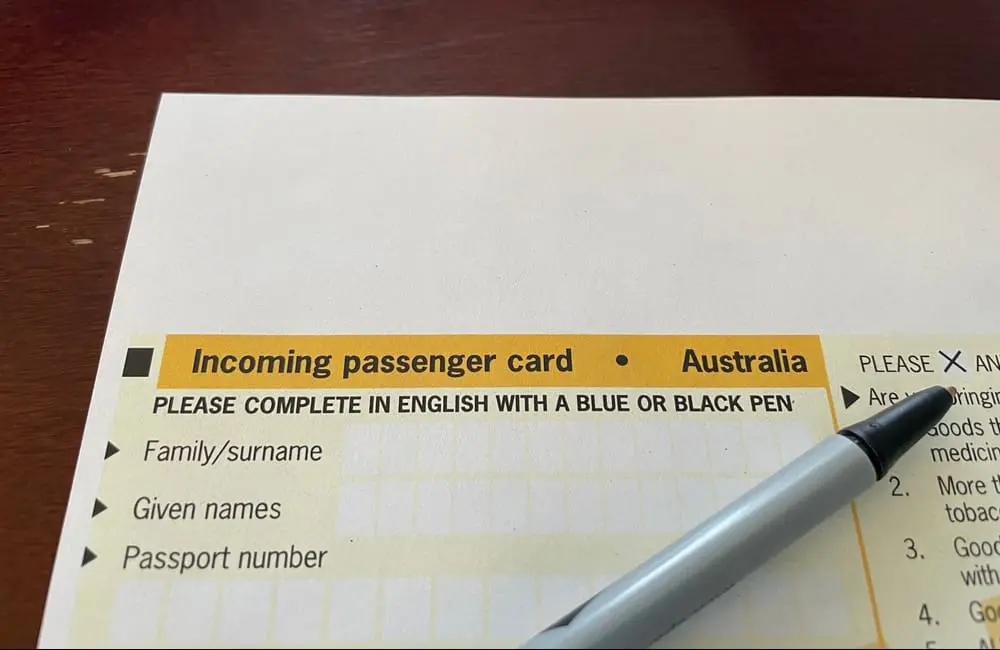 Australia's paper Incoming Passenger Card with pen.