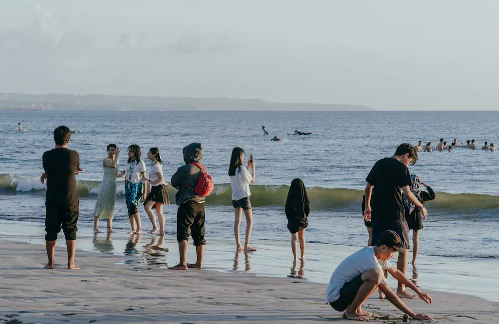 Holidaymakers on a Bali beach.