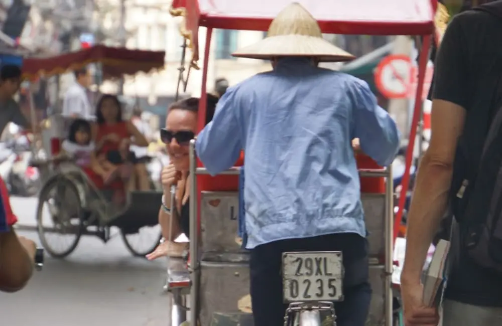 Movers + Shakers: Trails of Indochina adds Nadina Bross as ANZ Sales & Business Development Director 2 Woman in tuk-tuk in Hanoi, Vietnam