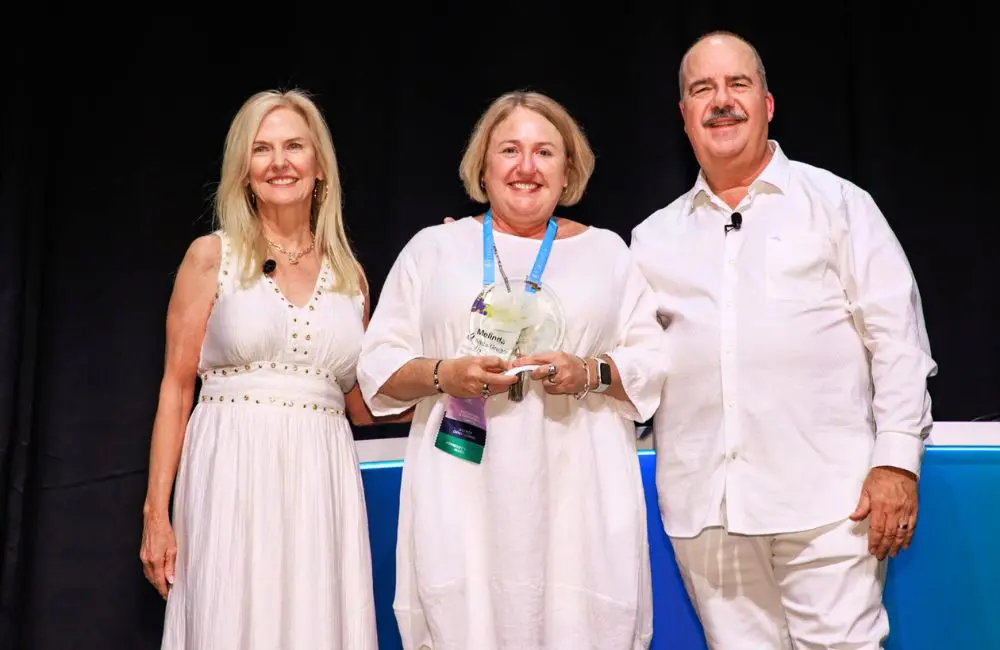 Melinda Gregor (centre) accepting her Cruise Ambassador Award from Melissa Araya, Virtuoso Vice President, Cruise; and Matthew Upchurch, Virtuoso Chairman and CEO