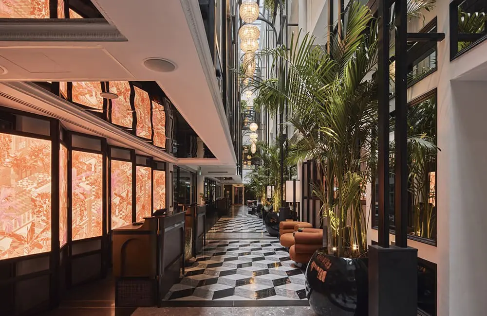 QT Singapore hotel is now open as brand expands to South-East Asia 6 Atrium at QT Singapore with artworks.