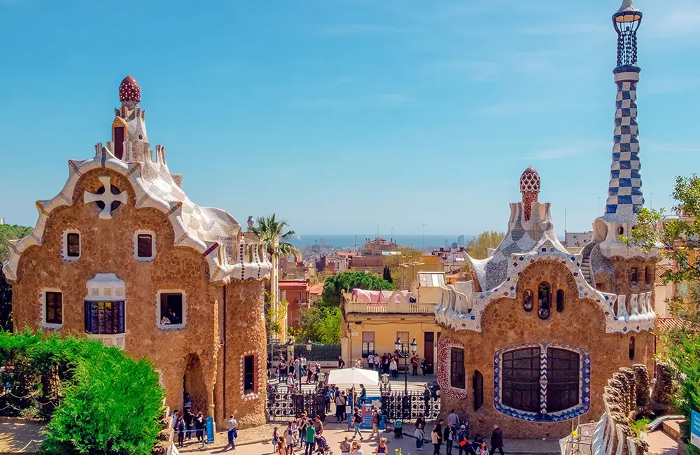 Star-studded line-up for Crystal’s 2025 themed cruises 3 Aerial view of Park Güell Barcelona with tourists.