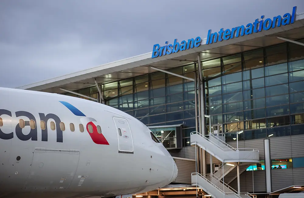 Nose of American Airlines aircraft outside Brisbane Airport gate.