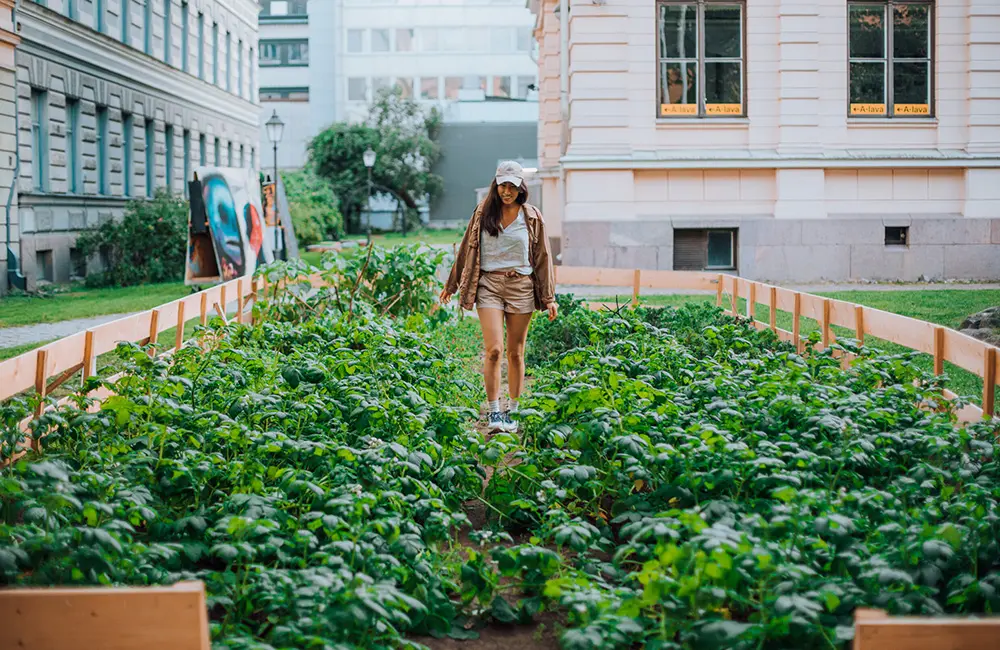 This European city is now the world’s most sustainable travel destination 4 A woman walks in an urban community garden in Annantalo for Helsinki residents. Image: Visit Finland/Julia Kivela Helsinki is the most sustainable travel destination in the world