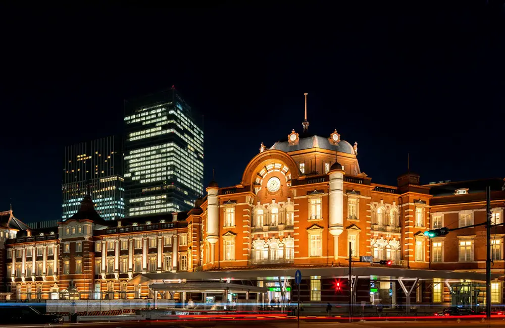 Make a Japan train holiday rail-ly easy for your clients with JR-East Hotels 3 The Tokyo Station Hotel exterior at night in Tokyo, Japan.