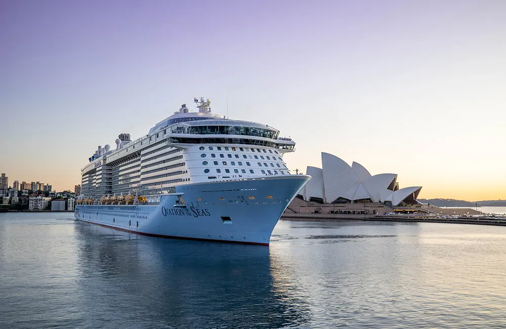 Standing ovation: Royal Caribbean ship sails into Sydney for record summer season 3 Ovation of the Seas in Sydney Harbour with Sydney Opera House in background.