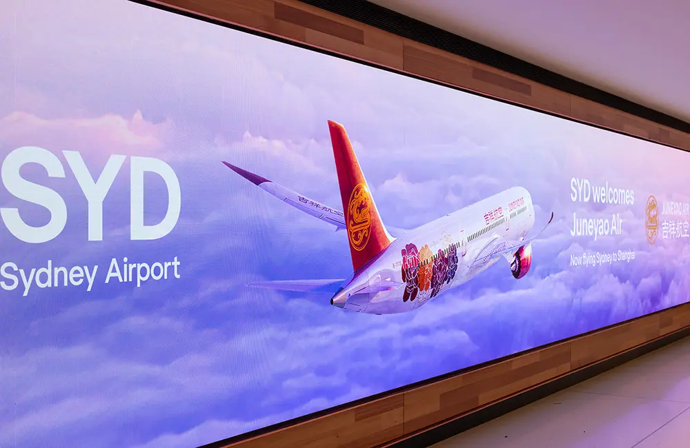 Ninth Chinese carrier makes history on inaugural flight from Shanghai to Sydney 1 Sign at Sydney Airport welcoming Juneyao Air.