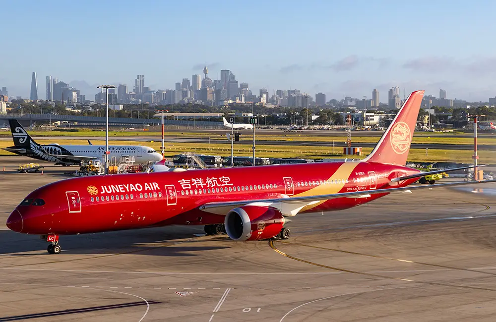 Ninth Chinese carrier makes history on inaugural flight from Shanghai to Sydney 2 Juneyao Air Boeing B787-9 aircraft on tarmac at Sydney Airport.