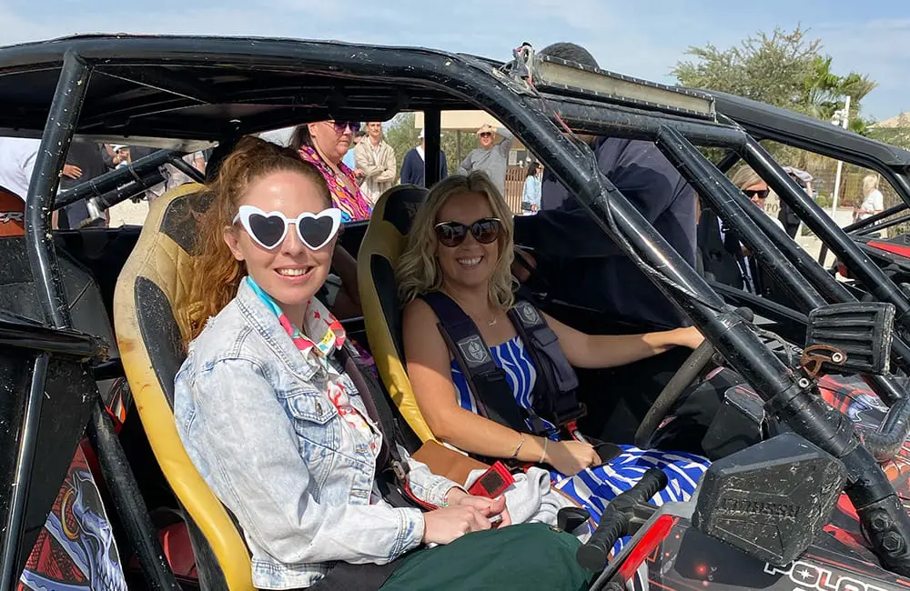 Qatar Airways and Visit Qatar Mega Famil wows 80 Aussie travel professionals in Doha 8 Close-up of two women in a dune buggy in desert near The Outpost Al Barari. Image: Cassie Tannenberg