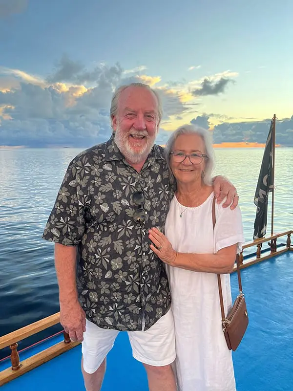 Older couple on boat in the Maldives on holiday.