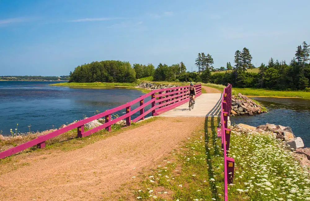 Atlantic Canada in autumn: 4 East Coast provinces with diverse cultures, sea-to-table flavours & alluring nature 10 Cyclist on the Morell and St Peters portion of the Confederation Trail on Prince Edward Island. Image: Carrie Gregory