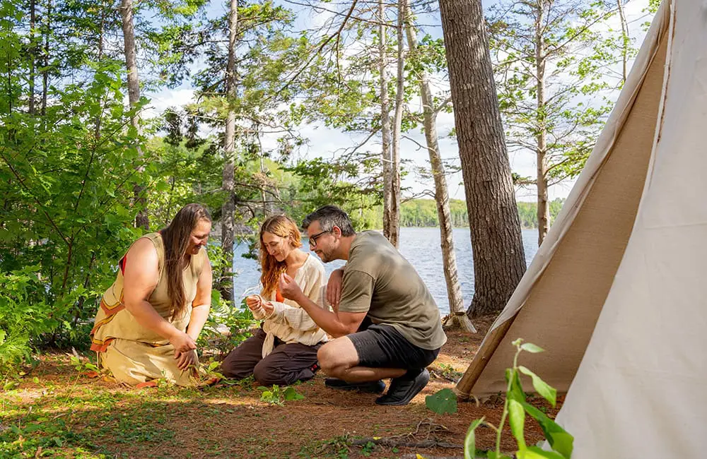 Atlantic Canada in autumn: 4 East Coast provinces with diverse cultures, sea-to-table flavours & alluring nature 3 Couple with guide experience Mi'kmaq culture outdoors in Nova Scotia. Image: Mike Morrison
