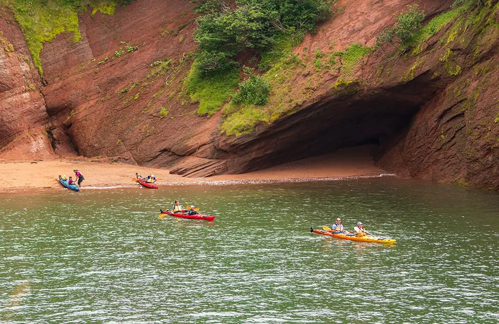 Atlantic Canada in autumn: 4 East Coast provinces with diverse cultures, sea-to-table flavours & alluring nature 11 Kayakers in the sea caves at the Bay of Fundy in New Brunswick. Image: Destination Canada