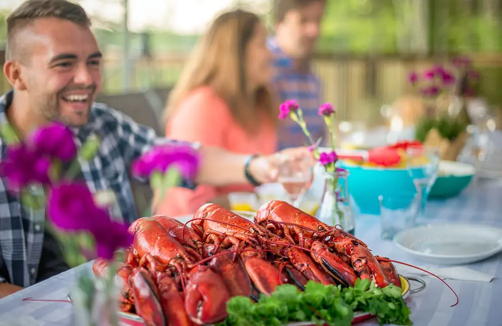Atlantic Canada in autumn: 4 East Coast provinces with diverse cultures, sea-to-table flavours & alluring nature 4 Lobster on set table. Image: Tourism Nova Scotia