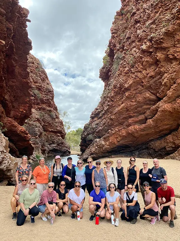 NT Round Up 2025: 20 Aussie & Kiwi agents explore the Red Centre across 6 days 5 NT Round Up 2025 group pose in Simpsons Gap.