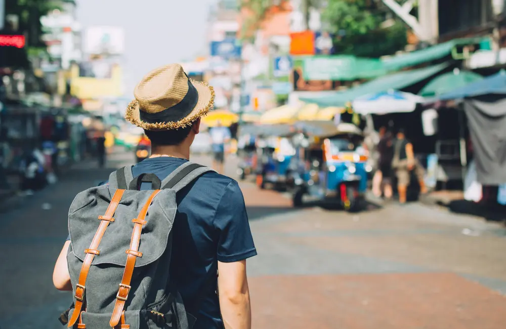 1 in 3 Aussies plan to head overseas in 2025 – and this is their most desired destination 3 Male backpacker at Khaosan Road outdoor market in Bangkok, Thailand. international destination