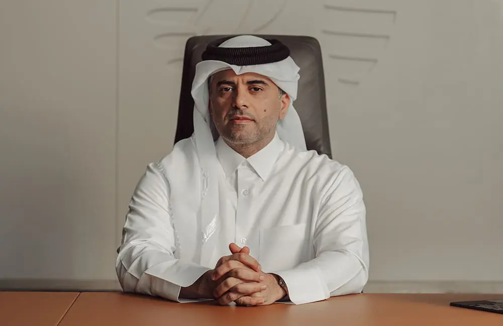 Qatar Airways breaks records with biggest-ever Boeing & GE Aerospace deals 2 Qatar Airways Group CEO Engr. Badr Mohammed Al-Meer at desk.