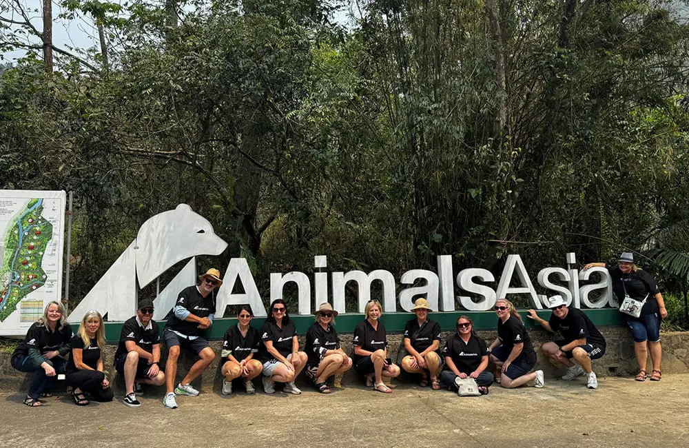 Making travel matter: Adventure World hosts CT Partners & Phil Hoffmann Travel on separate famils in Asia 2 Adventure World famil group at Animals Asia Bear Sanctuary sign in Vietnam.