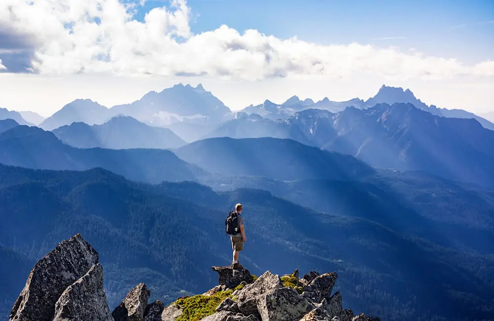2 in 3 Aussies say rising costs are impacting travel plans – well above the global average 3 Male hiker on mountain in US Pacific Northwest. Rising costs impact travel