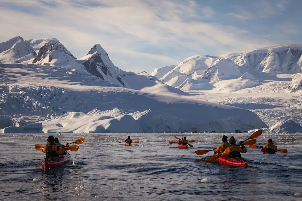 G Adventures reveals sleek new ship for Antarctic adventures, teases Polar expansion 1 Antarctica Mountain Range Group Kayaking G Adv