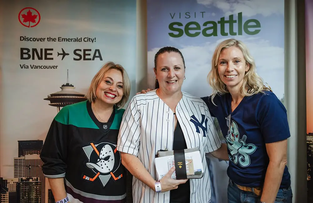 Brisbane swings big with bumper turnout at U-S-eh event with BNE, Air Canada & Linkd Tourism 3 Air Canada Seattle trip winner MTA Travel’s Zeena Croudace (centre) with Air Canada's Janis McDonald and Linkd Tourism's Amanda McCoy.