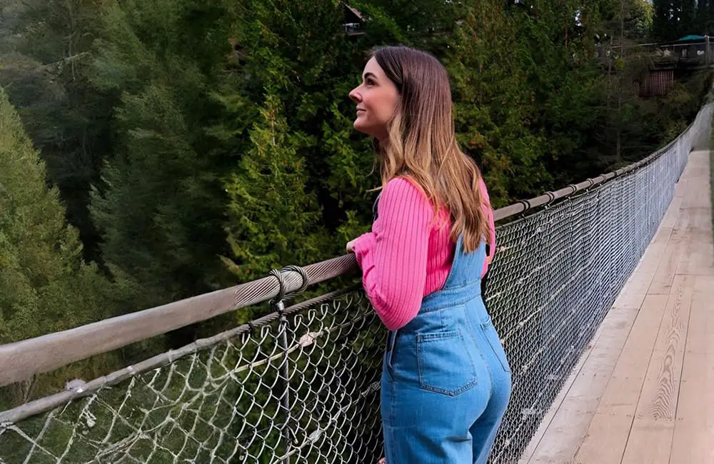 Why Canada is the ultimate bang-for-your-buck international destination for Aussies in 2025: 7 agent tips inside! 1 Flight Centre’s Kaitlyn Jensen at Capilano Suspension Bridge Park in Vancouver.