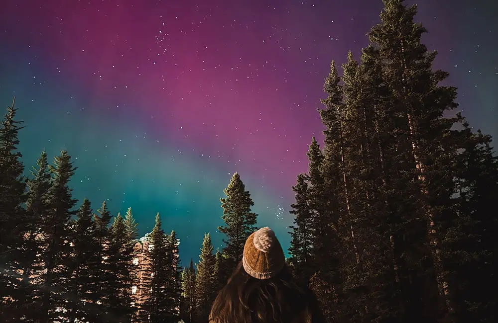 Why Canada is the ultimate bang-for-your-buck international destination for Aussies in 2025: 7 agent tips inside! 7 Warranambool Travel's Josie Allen looking at Northern Lights at Lake Louise.