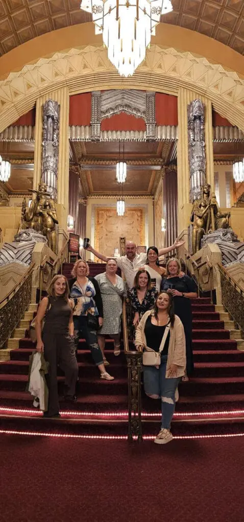 Golden State of mind: Delta top-sellers live the California dream on premium famil 2 Group of people pose on steps at Hollywood Pantages Theatre.