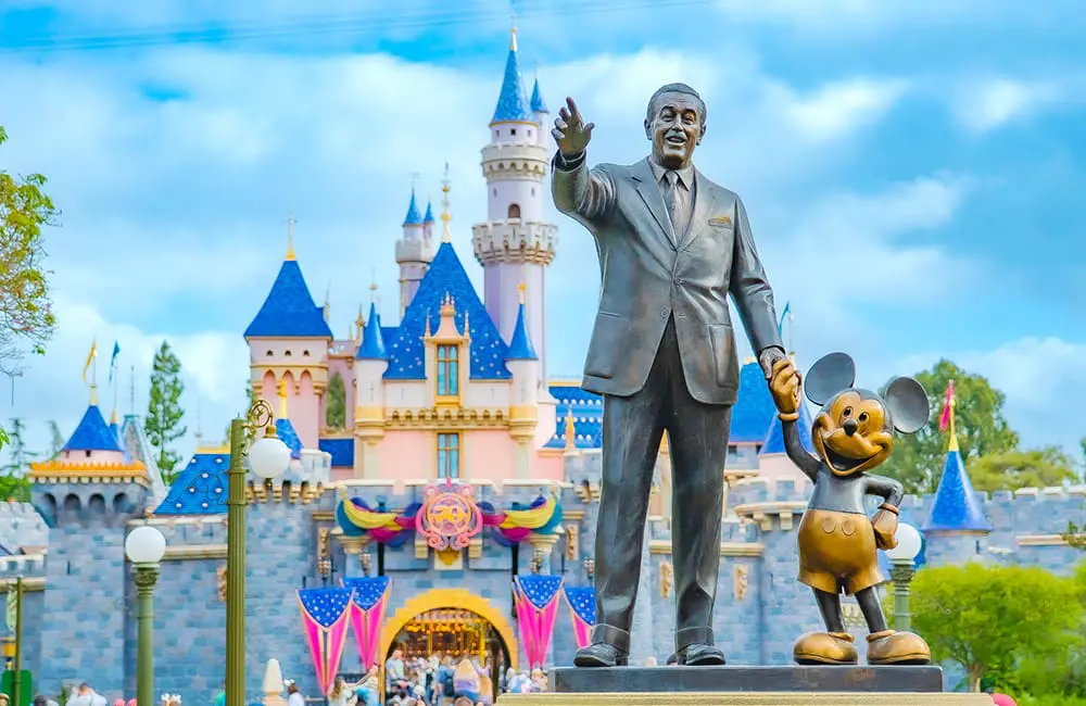 Disneyland Resort commences 70th celebrations as Anaheim embraces 2025 & 2026 anniversaries 1 Walt Disney and Mickey Mouse statue outside Castle decorated for Disneyland Resort's 70th Anniversary Celebrations. Image: Disney