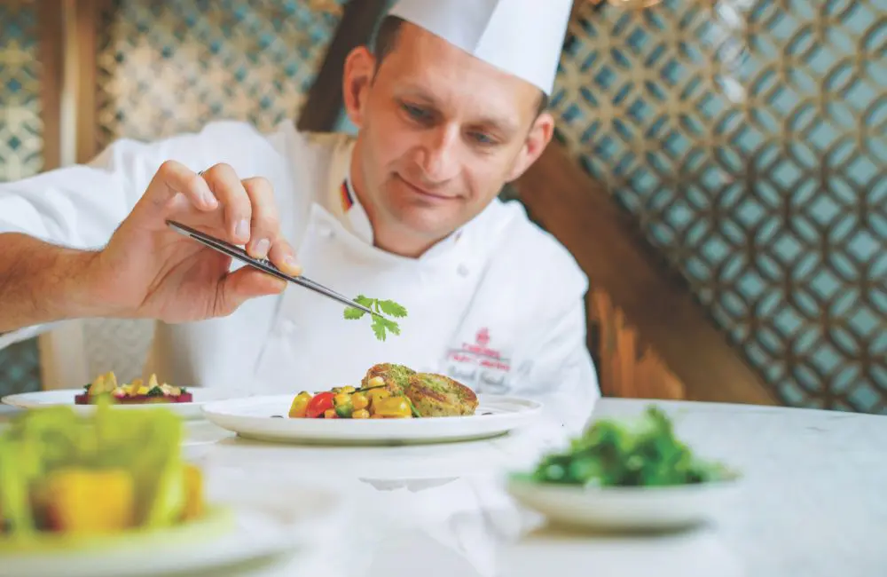 Raise a glass: Emirates elevates inflight dining with exclusive champagne pairings 1 The airline's culinary team plating up