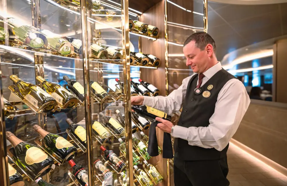 Princess Cruises' Nick Ferguson on what Aussie cruisers want & where they want to go in 2025 9 Waiter with wine at The Sanctuary wine cellar on Sun Princess.