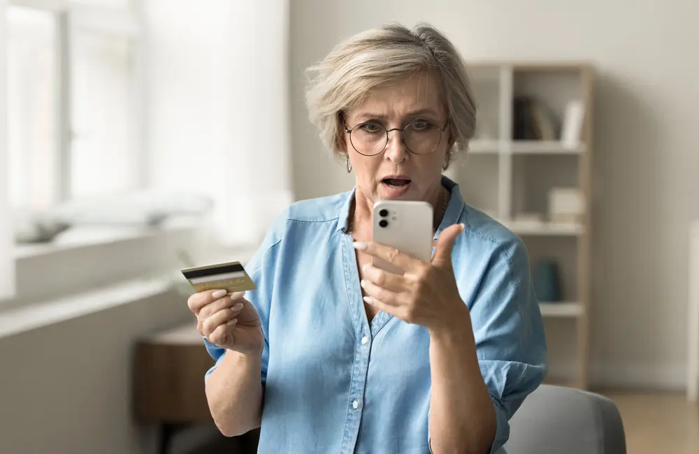 From jet lag to debt lag? 1 in 5 Aussies put their travel dreams on credit, research reveals 2 Shocked mature woman holds credit card and looking at smartphone screen – frequent flyer points